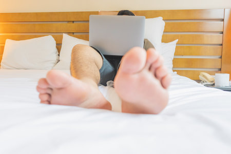 Young man traveling the world working as a freelancer. Sharing with the world all the content he does.の写真素材