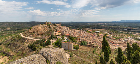 Landscape of the countryside with the bell tower of La Fresnada in Teruel, Spainの写真素材