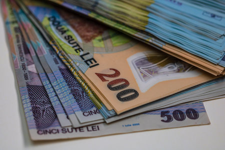 Selective focus on stack of LEI romanian money. Lei banknotes isolated.