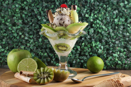 amazing ice cream preparation with kiwi, cherry, strawberry and natural backgroundの写真素材
