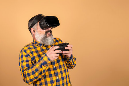 hipster man with virtual reality glasses and game controllerの写真素材