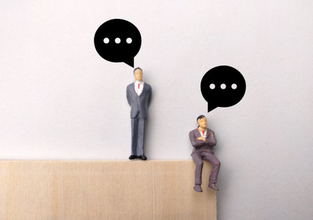 Miniature people,wooden board and conversation on white background.の写真素材