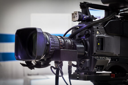 Video camera lens - recording show in TV studio - focus on camera aperture