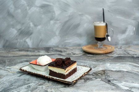 a slice of cake on a marble floorの写真素材