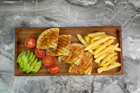 toast in wooden serving platter on marble background