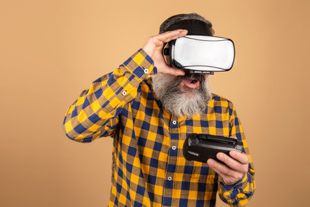 Middle-aged hipster wearing virtual reality headsets. VR, future, gadgets, technology conceptの写真素材