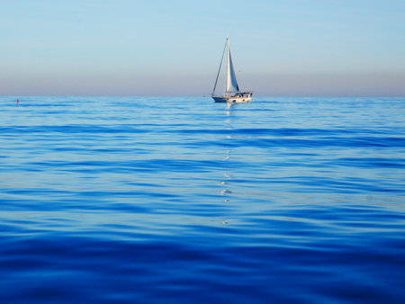 Beautiful photo of a sailing boat on the Mediterranean Seaの写真素材