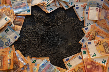 Euro bills on a black background with room for copy. Currency concept.