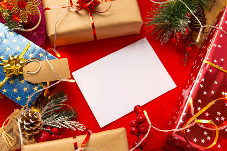 Blank card, christmas background with gifts and Christmas tree lightsの写真素材