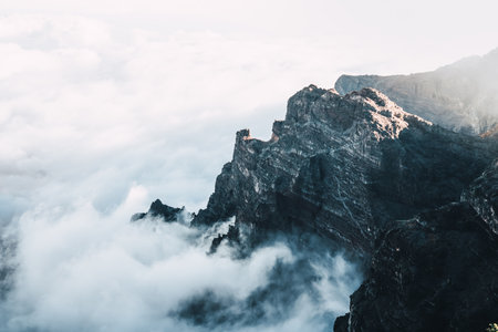 high on a mountain with a sea of clouds at sunset