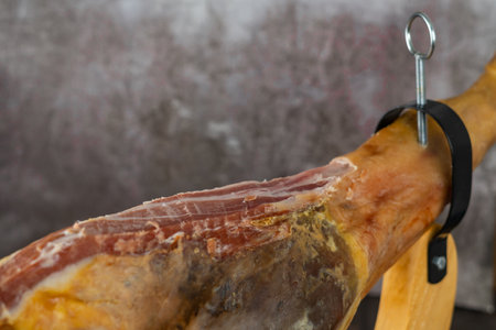 spanish acorn-fed iberian ham close-up open knife cutの写真素材