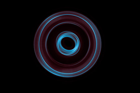 Light painted glowing abstract blue and red curved lines on a black background