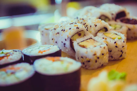 Close up vegetarian sushi which is on a wooden pallet.の写真素材