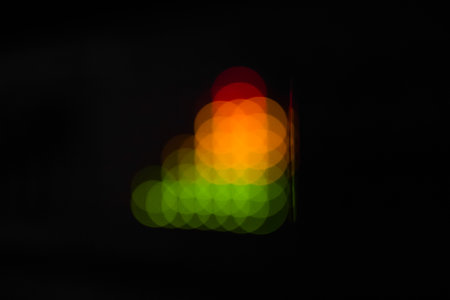 Blurred equalizer bars - abstract colorful dots. In green, yellow, orange and red colors.の写真素材