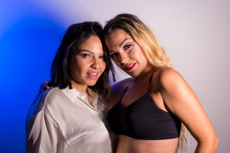 Model with makeup artist lovingly after studio sessionの写真素材