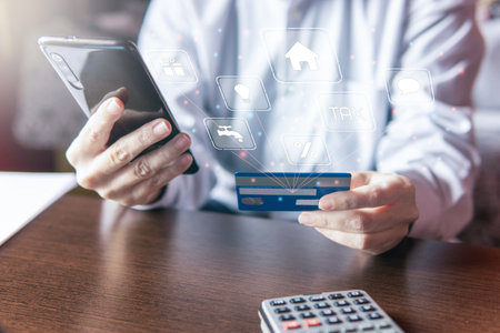 Woman using smartphone with credit card, ordering online shopping. Working from home concept