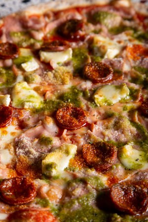 Pizza background - macro photo of spicy sausage pizzaの写真素材