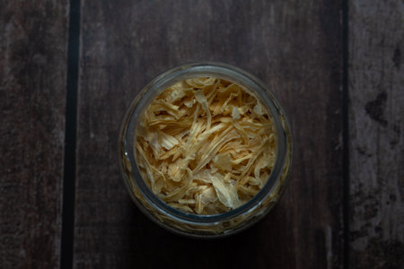 glass jar with dried onion, zenithal viewの写真素材