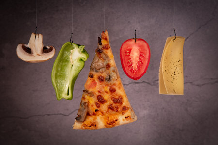 Slice of mozzarella delicious pizza tomato cheese peeper and mushroom ingredientsの写真素材