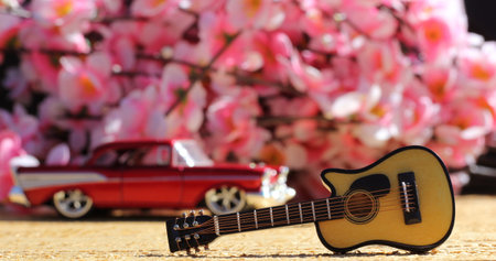 Guitar with Vintage Car and Cherry Blossoms, Shallow DOFの写真素材