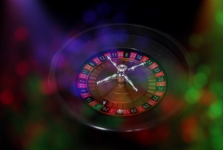 Casino Games With Colorful Bokeh PArty Lights Roulette wheel