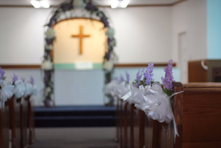 Interior of Small Rural Wedding Chapel Decorated For Wedding, Shallow DOF Focus on Flowersの写真素材