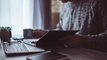 young person working from home by video call and looking at annotations