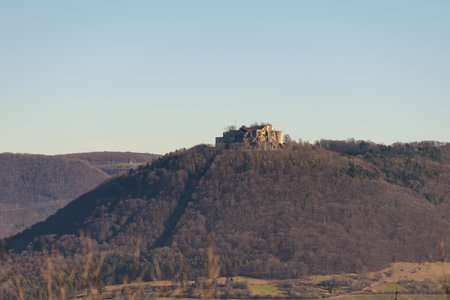 Castle Hohen Neuffen on Swabian Alb in autumn sun under blue skyの写真素材
