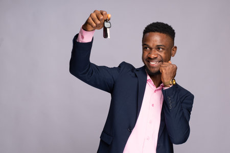 black man holding a car key rejoicingの写真素材