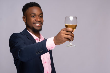 young black business man making a toastの写真素材