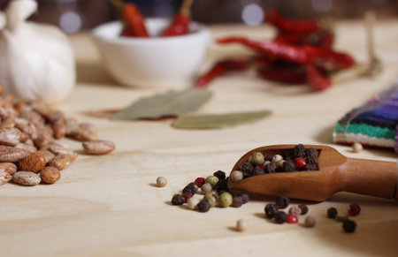 Burlap Sack of Pinto Beans on Table with Spices in Background Shalloe DOF