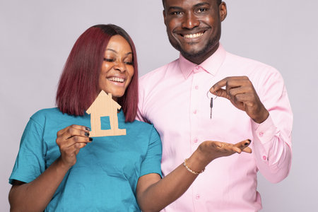 african man gifting a woman a house conceptの写真素材
