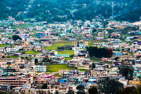 A shot of developed city situated in a valley of Uttarakhand. Landscape shot of bageshwar city.
