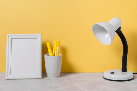 arrangement with desk lamp pensの写真素材