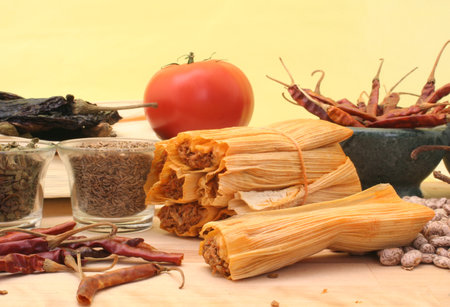 Tamales With Garlic, Beans and Tomato with Yellow Backgroundの写真素材
