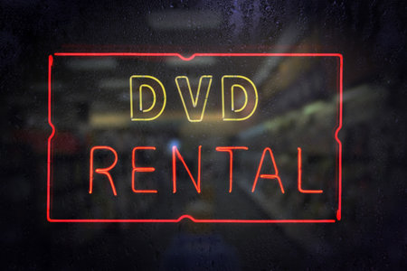 Neon Movie Rentals Sign in Rainy Window