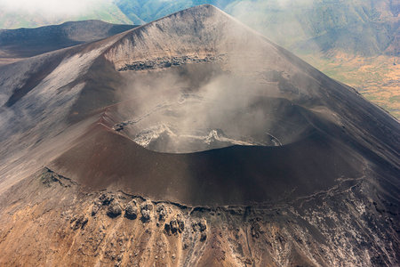 Stunning birds eye view closeup photography of a smoking volcano caldera in the Serengeti, Tanzania.の写真素材