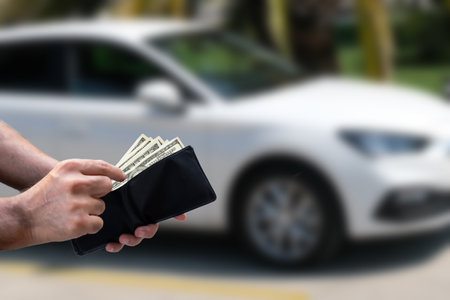 human hand paying cash, selective focus.の写真素材