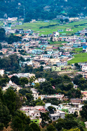 A shot of developed city situated in a valley of Uttarakhand. Landscape shot of bageshwar city.