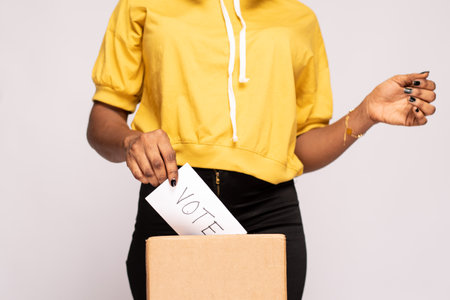 young african woman casting her vote