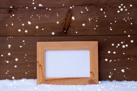blue christmas decoration on white snow christmas tree balls snowflakesの写真素材