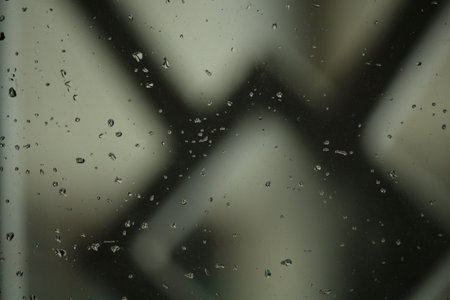 Rain water has fallen on the window glass.