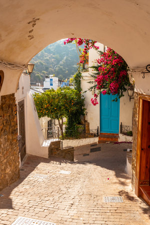The city gate of Mojacar with white houses on top of the mountain. Costa Blanca in the Mediterranean Sea, Almeria. Spainの写真素材
