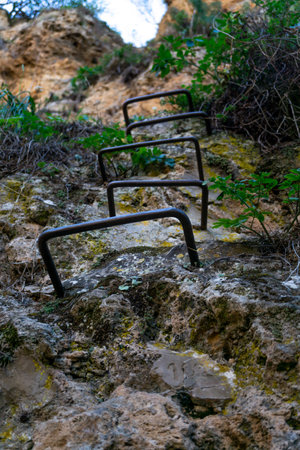 Old metal steps used for climbing leading to a mountain in Ronda, Spain , via ferrata turistica
