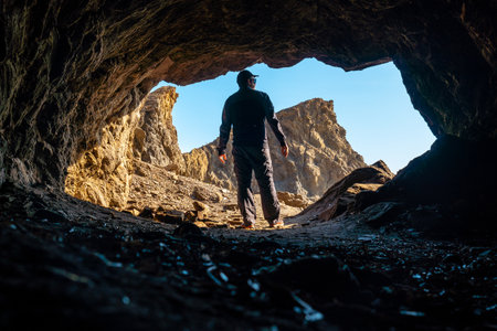 A young tourist in the Almanzora caves, Cala PeÃ±on cut off a virgin and hidden beach in...