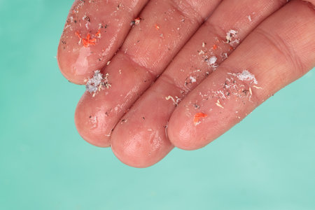 Close-up of of microplastics lay on people's hands. Concept of water pollution. Idea for climate...