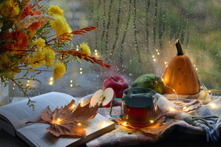 Autumn Decor with Flowers, Open Book and Cup Of Tea