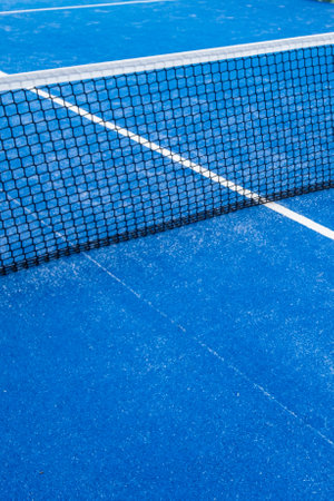 partial view of the netting of a blue paddle tennis courtの写真素材