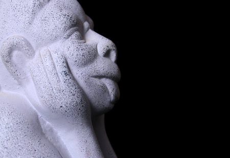 Gargoyle Statue, close-up on Black Backgroundの写真素材