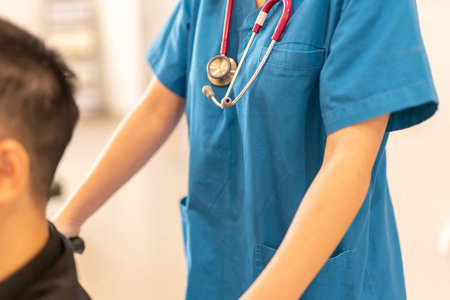 unrecognizable doctor help disable patient with wheelchair.の写真素材